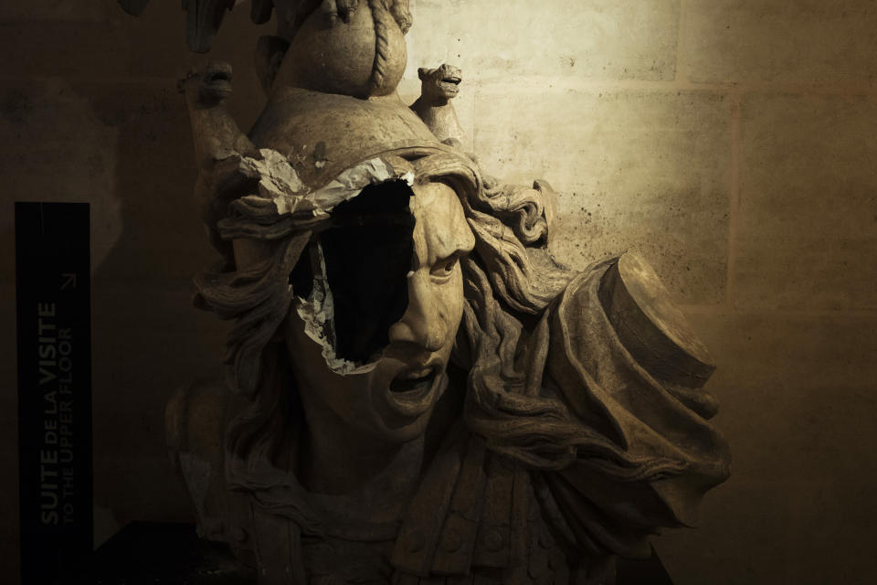 A broken sculpture of Marianne, symbol of the French Repupblic, appears damaged in the gallery inside the Arc de Triomphe during a demonstration Saturday, Dec.1, 2018 in Paris. A French protest against rising taxes and the high cost of living turned into a riot Saturday in Paris as police fired tear gas and water cannon in street battles with activists wearing the fluorescent yellow vests of a new movement. (AP Photo/Kamil Zihnioglu)