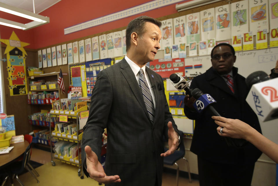 John Sasaki, communications director with Oakland Unified School District, speaks to reporters in an empty classroom at Manzanita Community School in Oakland, Calif., Thursday, Feb. 21, 2019. Teachers in Oakland, California, went on strike Thursday in the country's latest walkout by educators over classroom conditions and pay. (AP Photo/Jeff Chiu)