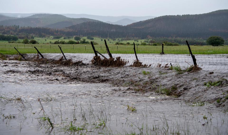 August 8, 2022, USA: Flood water flows over a field near Rociada Monday, August 8, 2022. Storm water running off the Calf Canyon/Hermits Peak burn scare his flooding many of the streams and arroyos in the area. (Credit Image: © Eddie Moore/Albuquerque Journal via ZUMA Press Wire)