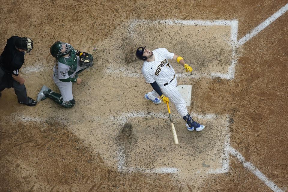 Milwaukee Brewers' Victor Caratini reacts in front of Oakland Athletics' Shea Langeliers as he pops out to end the ninth inning of a baseball game Saturday, June 10, 2023, in Milwaukee. (AP Photo/Morry Gash)