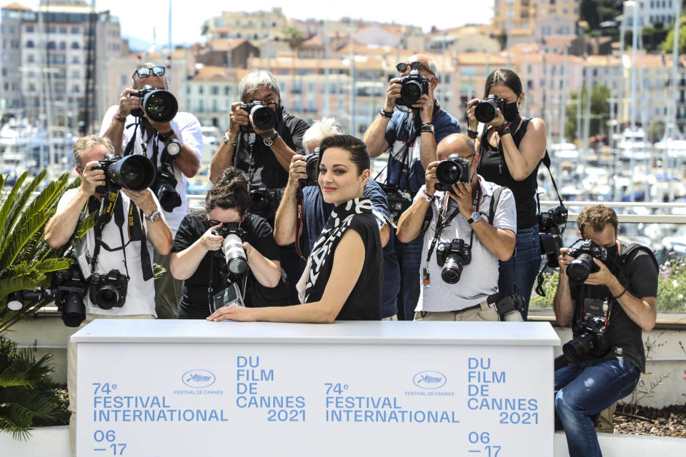 FILE - In this July 6, 2021 file photo Marion Cotillard poses for photographers at the photo call for the film Annette at the 74th international film festival, Cannes, southern France. (Photo by Vianney Le Caer/Invision/AP, File)