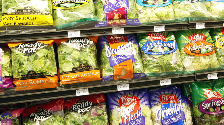 Rows of prepackaged salads in gorcery store