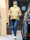 <p>Emma Roberts wore a yellow sweater, jeans and a neon yellow mask as she went about her day on Monday in L.A.</p>