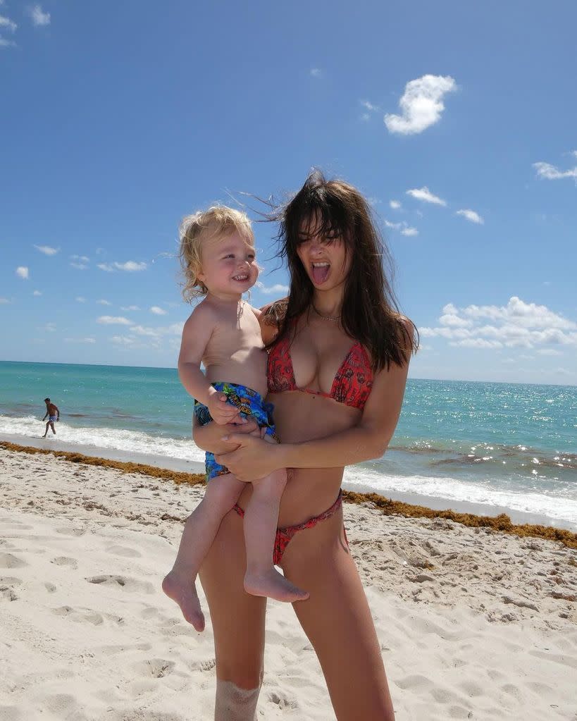 Emily Ratajkowksi in a bikini on the beach