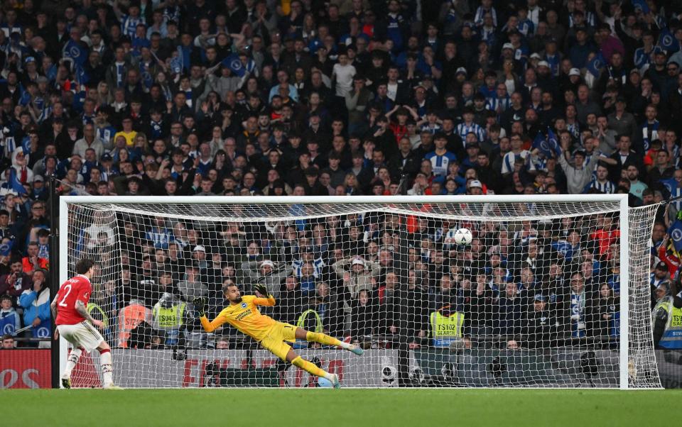 Manchester United's Swedish defender Victor Lindelof scores the winning penalty past Brighton's Spanish goalkeeper Robert Sanchez in a penalty shootout - GLYN KIRK/AFP via Getty Images