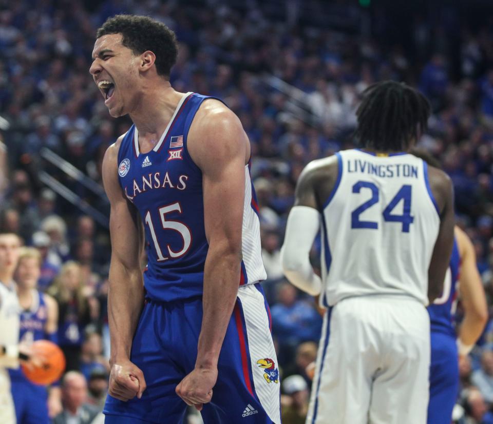 Kansas guard Kevin McCullar Jr. celebrates tying up Kentucky forward Chris Livingston.