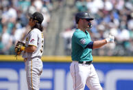 Seattle Mariners' Ty France gives a thumbs up after hitting a double as Pittsburgh Pirates second baseman Ji Hwan Bae looks away during the fourth inning of a baseball game Saturday, May 27, 2023, in Seattle. (AP Photo/Lindsey Wasson)