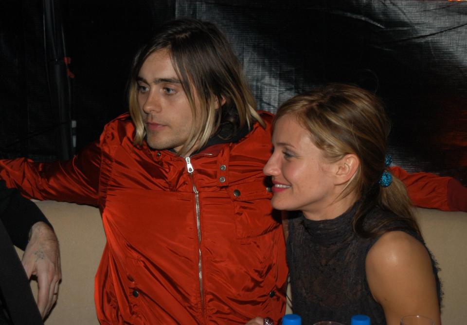 Jared Leto and Cameron Diaz sitting together at a 2000 event