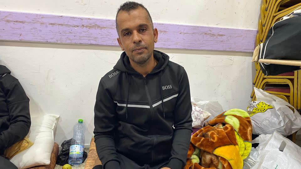 Ismail Abd Almagid, who is from Gaza but had a permit to work in Israel, has been staying in a refugee camp in the West Bank. - Ivana Kottasova/CNN