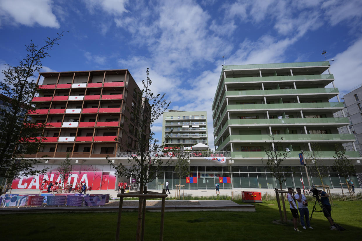 The Canadian, left, and Israeli residences for athletes are seen in the Olympic Village at the 2024 Summer Olympics, Tuesday, July 23, 2024, in Paris, France. (AP Photo/Rebecca Blackwell)