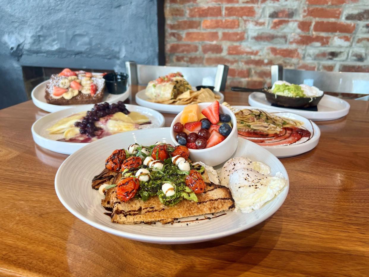 A variety of dishes at Morning Fork/Fork & Barrel restaurant in Louisville, including avocado toast, sweet and savory crepes, banana bread french toast, a veggie burrito, and more.
