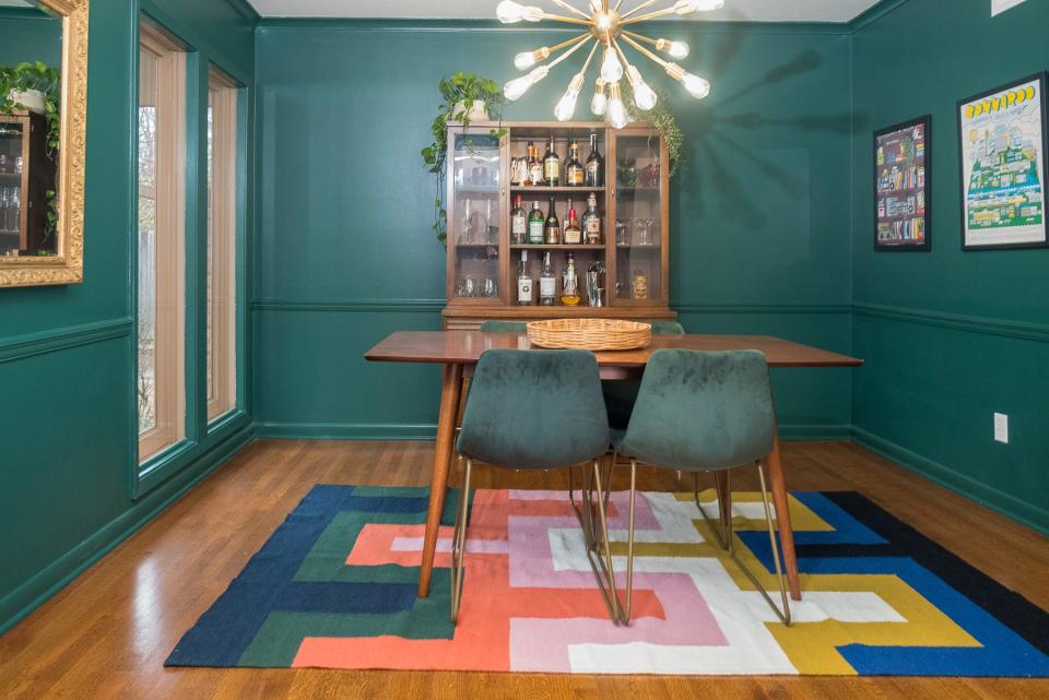 Bold colors are used throughout the home, as shown here in the dining room.