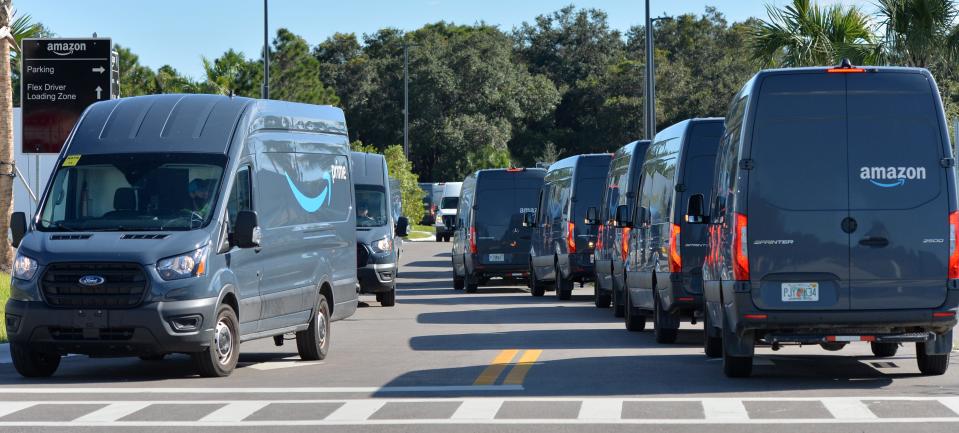 Amazon delivery trucks line up outside the company’s delivery station on Commerce Drive in Venice.