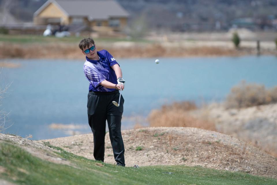 Rye High School's Emma Garcia chips onto the third hole green during a tournament at Four Mile Ranch Golf Club on April 13.
