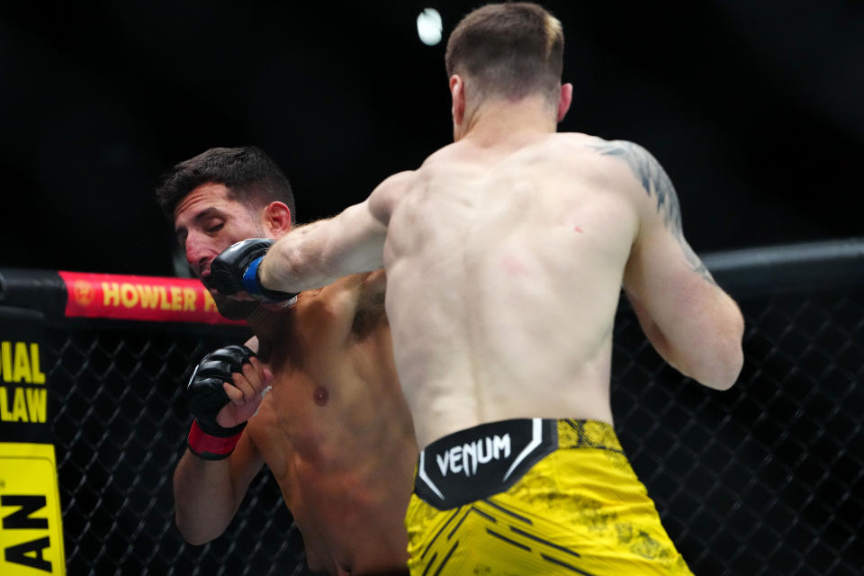 Sep 16, 2023; Las Vegas, Nevada, USA; Alex Reyes (red gloves) fights Charlie Campbell (blue gloves) during UFC Fight Night at T-Mobile Arena. Mandatory Credit: Stephen R. Sylvanie-USA TODAY Sports