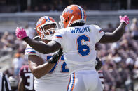 Florida running back Nay'Quan Wright (6) celebrates with teammate Stone Forsythe (72) after a short touchdown run against Texas A&M during the second quarter of an NCAA college football game, Saturday, Oct. 10, 2020, in College Station, Texas. (AP Photo/Sam Craft)
