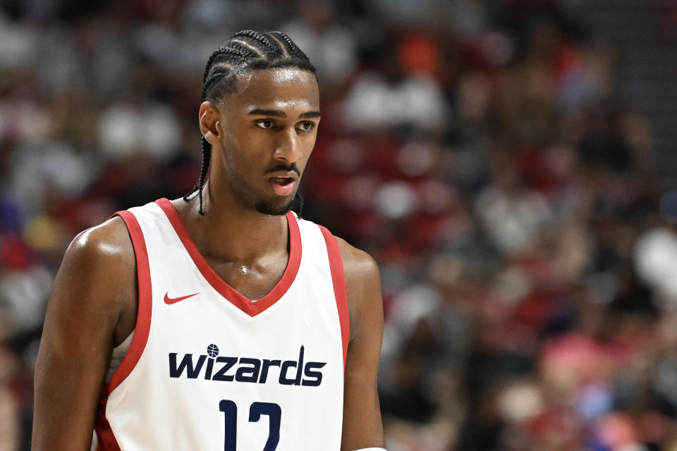 LAS VEGAS, NEVADA - JULY 12: Alex Sarr #12 of the Washington Wizards looks on against the Atlanta Hawks in the first half of a 2024 NBA Summer League game at the Thomas & Mack Center on July 12, 2024 in Las Vegas, Nevada. The Wizards defeated the Hawks 94-88. NOTE TO USER: User expressly acknowledges and agrees that, by downloading and or using this photograph, User is consenting to the terms and conditions of the Getty Images License Agreement. (Photo by Candice Ward/Getty Images)