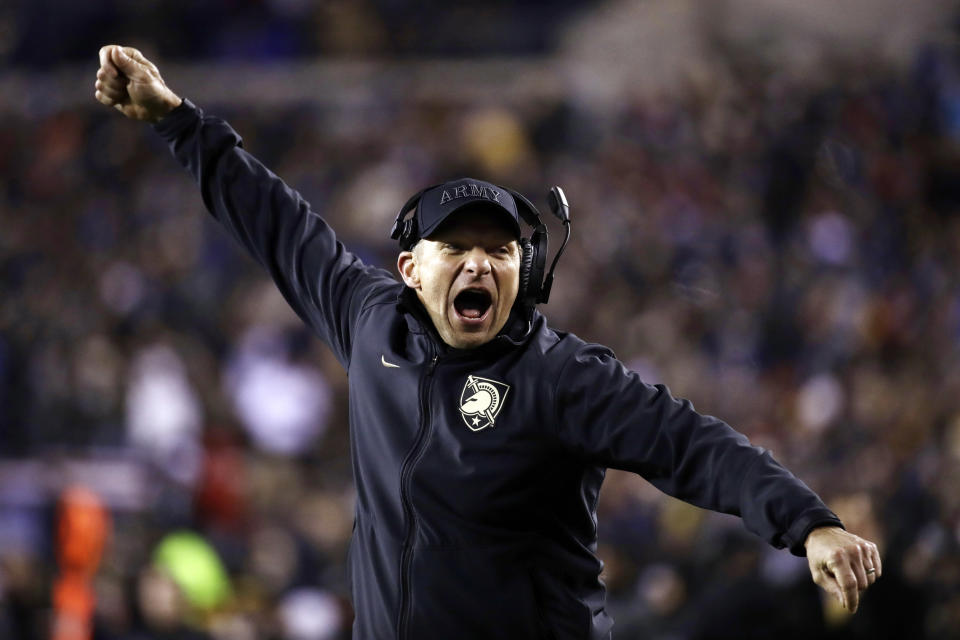 FILE - In this Dec. 8, 2018, file photo, Army head coach Jeff Monken cheers during the second half an NCAA college football game against the Navy in Philadelphia. The 120th Army-Navy game is set for Saturday in Philadelphia. Army is trying to win its fourth straight game in the series. (AP Photo/Matt Rourke, File)