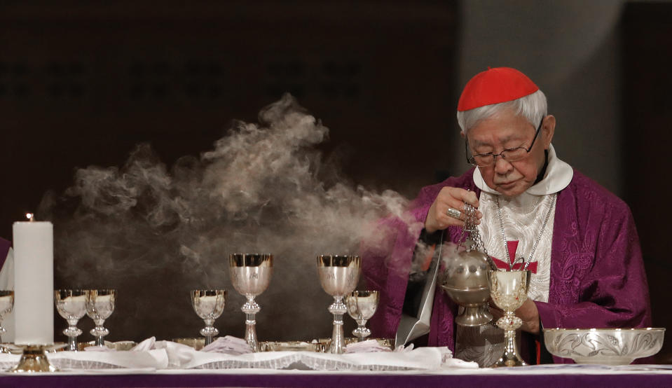 FILE - Cardinal Joseph Zen, a vocal opponent of attempts by Beijing and the Vatican at rapprochement, presides over a vigil Mass for Bishop Michael Yeung in Hong Kong, Thursday, Jan. 10, 2019. Five conservative cardinals are challenging Pope Francis to affirm Catholic teaching on homosexuality and female ordination. They've asked him to respond ahead of a big Vatican meeting where such hot-button issues are up for debate. The cardinals on Monday published five questions they submitted to Francis, known as “dubia.” (AP Photo/Vincent Yu, file)
