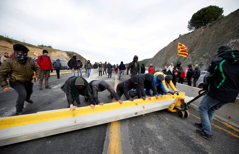 Members of Catalan protest group Democratic Tsunami block AP-7 highway on the French side of the Spanish-French border