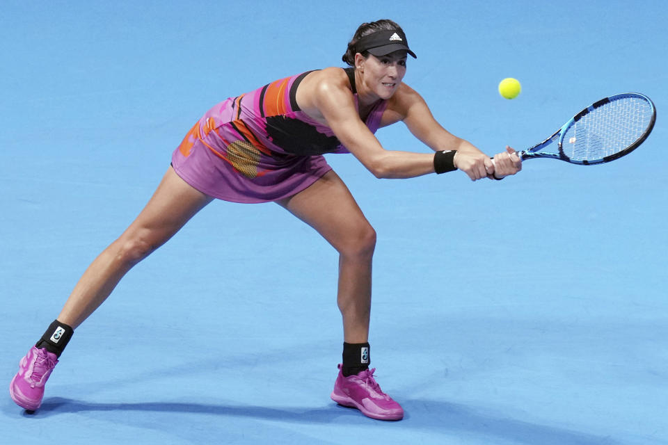 Garbine Muguruza of Spain returns a shot against Liudmila Samsonova of Russia during a singles quarterfinal match in the Pan Pacific Open tennis tournament at Ariake Colosseum Friday, Sept. 23, 2022, in Tokyo. (AP Photo/Eugene Hoshiko)