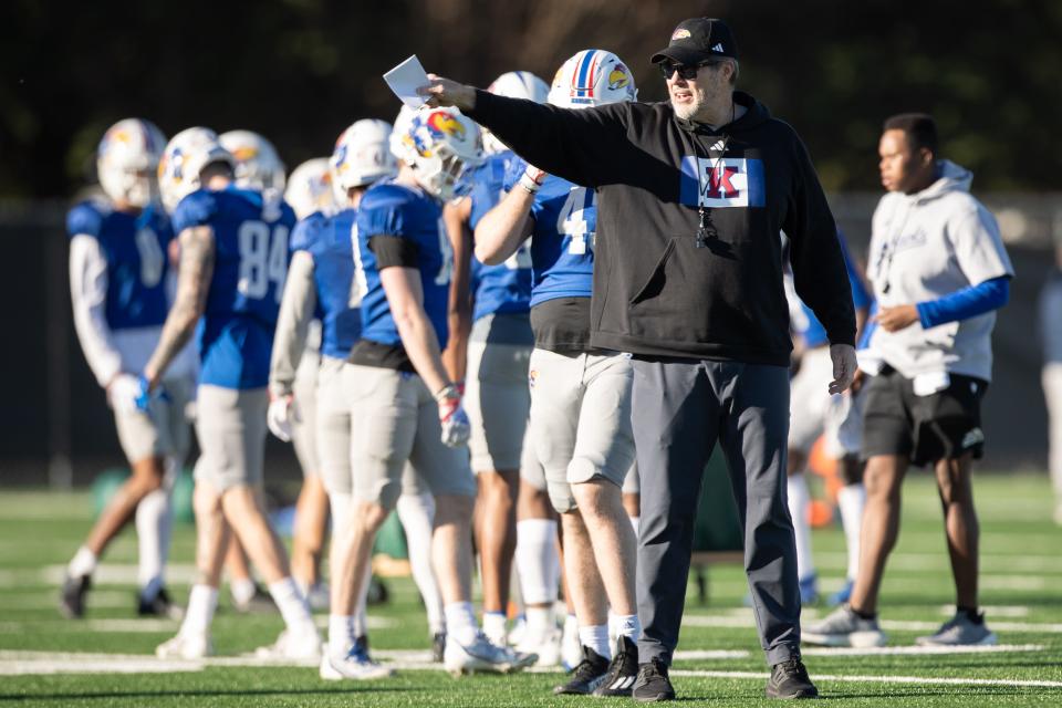 Kansas assistant head coach and offensive coordinator Jeff Grimes directs players during a practice April 4, 2024 in Lawrence.