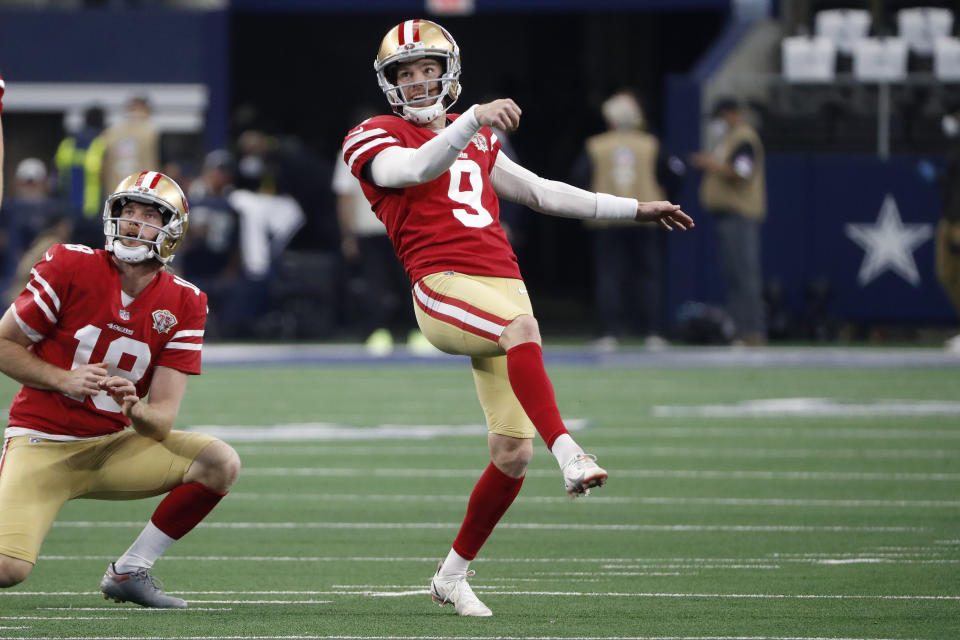FILE - San Francisco 49ers kicker Robbie Gould (9) warms up with Mitch Wishnowsky (18) before an NFL wild-card playoff football game against the Dallas Cowboys in Arlington, Texas, Sunday, Jan. 16, 2022. Coach Kyle Shanahan has a simple request for the San Francisco 49ers special teams units each week. With a dynamic offense and fearsome pass rush leading a stout defense, he just wants to avoid catastrophes in the kicking game.(AP Photo/Roger Steinman, File)