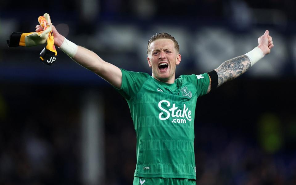 Everton's Jordan Pickford celebrates after the match