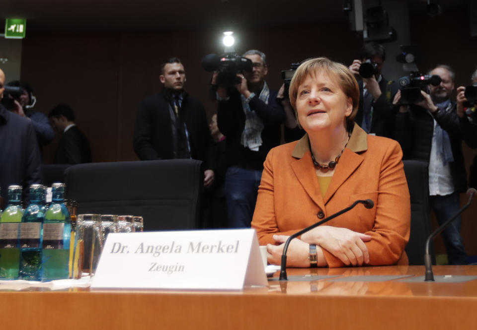 German Chancellor Angela Merkel arrives for a questioning at an investigation committee of the German federal parliament looking into alleged U.S. surveillance in Germany and the activities of Germany's own foreign intelligence service in Berlin, Germany, Thursday, Feb. 16, 2017. (AP Photo/Michael Sohn)