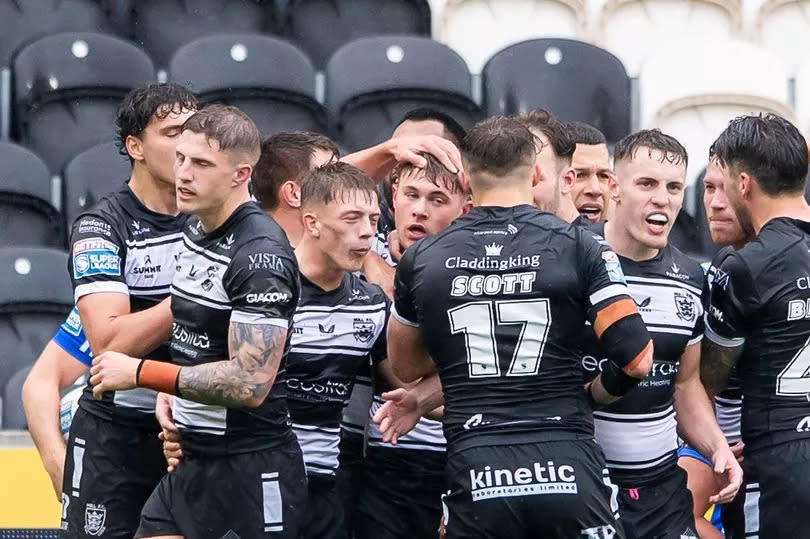 Hull FC celebrate Denive Balmforth's try against Leeds.