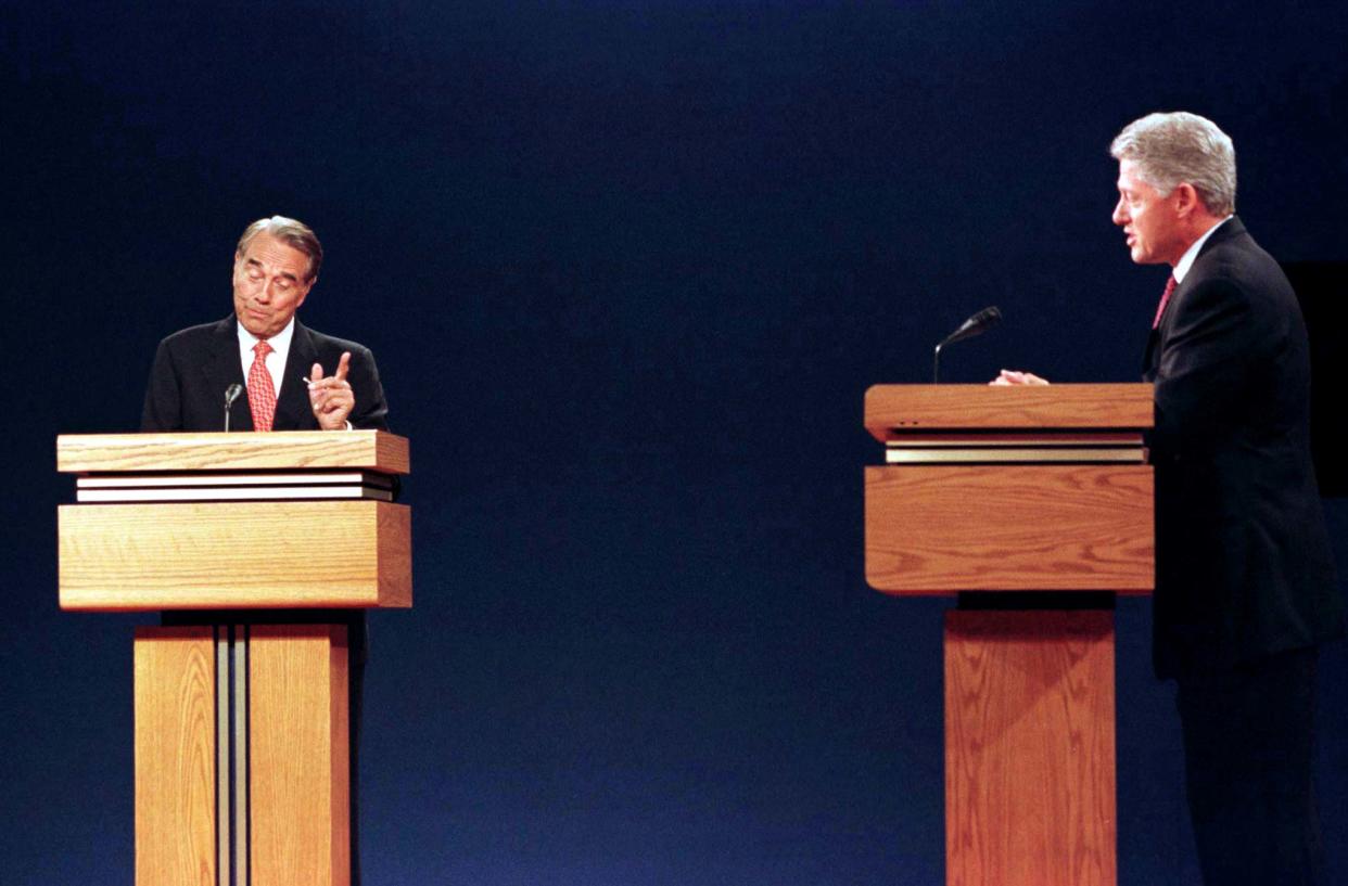 Republican presidential nominee Bob Dole (L) makes a point during the first of the presidential debates against U.S. President Bill Clinton at the Bushnell Theater in Hartford Connecticut, October 6. Standing a few feet apart behind lecterns, the two candidates hammered at each other in a 90-minute encounter. Dole attacked Clinton on foreign policy, drugs, the economy and his own credibility.