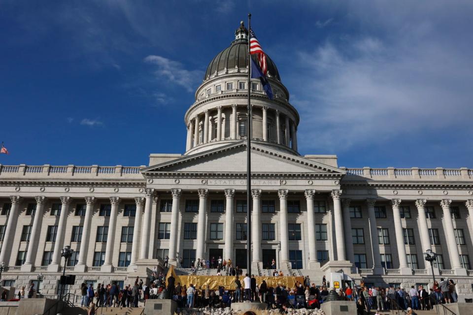 The Golden Spike Monument arrives in front of the state Capitol in Salt Lake City on Monday, Oct. 23, 2023. The 43-foot-tall golden spike statue was commissioned as a public art piece by the Golden Spike Foundation to honor the tens of thousands of railroad workers who built the transcontinental railroad. | Megan Nielsen, Deseret News