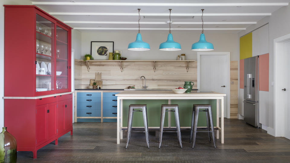 <p> Color blocking, which involves mixing up sections of two or more solid colors, is a dynamic way to enliven kitchen cabinets. This bespoke kitchen belonging to Peter Thwaites and Rebecca Aird, owners of fabric and wallpaper brand Rapture & Wright, was inspired by the expressionist art of Mondrian. </p> <p> "Since the kitchen is one part of a large multi-use area, I was keen that the furniture should retain a ‘lightness’, delivered by free-standing pieces in uplifting colors," explains Peter. Each freestanding piece is linked by exposed ash timber accents to give the simple color blocking a sense of overall cohesion. The dresser is painted in Incarnadine by Farrow & Ball; the island is painted in Olive Color by Little Greene; and the base units are in Burlington Arcade by Mylands.  </p> <p> Color blocking can also be an effective way to zone an open-plan kitchen, by using one shade on the kitchen cabinets, another in the dining area, and so on.  </p>