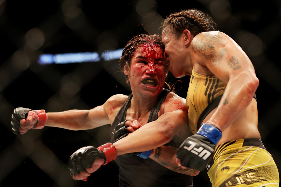 DALLAS, TEXAS - JULY 30: Julianna Pena (L) exchanges strikes with Amanda Nunes of Brazil in their bantamweight title bout during UFC 277 at American Airlines Center on July 30, 2022 in Dallas, Texas. (Photo by Carmen Mandato/Getty Images)