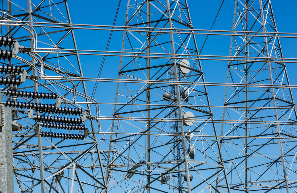 BUTTONWILLOW, CA - MARCH 28:  High tension electrical power lines at a transfer station along Highway 58 are viewed on March 28, 2017, near Buttonwillow, California. Oil and natural gas production have been joined by solar panels and wind turbines to provide large scale electrical energy for the entire Western United States.  (Photo by George Rose/Getty Images)