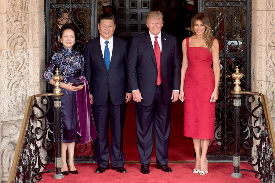 President Donald Trump and First Lady Melania Trump pose for a photo with Chinese President Xi Jinping and his wife, Mrs. Peng Liyuan, Thursday, April 6, 2017, at the entrance of Mar-a-Lago in Palm Beach, Fla.