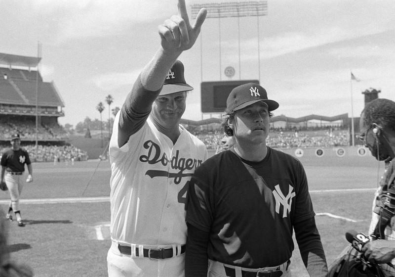 Los Angeles Dodger pitcher Jerry Reuss gives the big number one standing with New York Yankees Rich Gossage during warm-ups, July 8, 1980 in Los Angeles for the All-Star Game Tuesday. (AP Photo/Lennox McLendon)