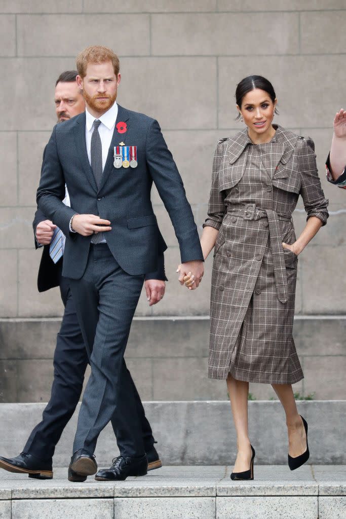 <p>This isn's a wrap coat per se, but worn in the style of one. For her visit to New Zealand with Prince Harry in October 2018, the Duchess of Sussex chose plaid Karen Walker which she cinched at the waist. </p>