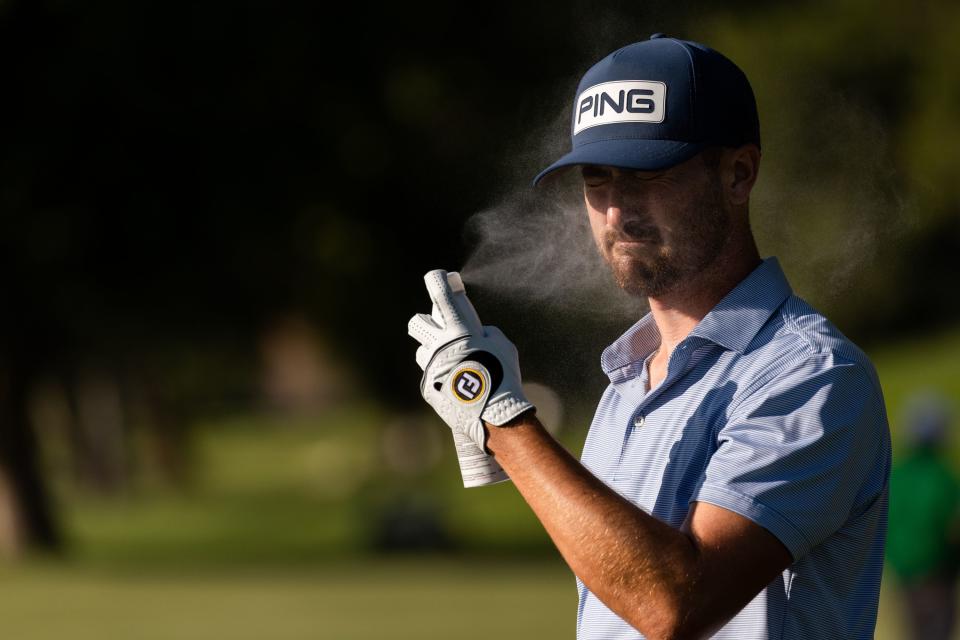 Christopher Petefish applies sunscreen on the 18th hole during the Utah Championship, part of the PGA Korn Ferry Tour, at Oakridge Country Club in Farmington on Sunday, Aug. 6, 2023. Petefish finished second place with -23. | MEGAN NIELSEN, Megan Nielsen, Deseret News