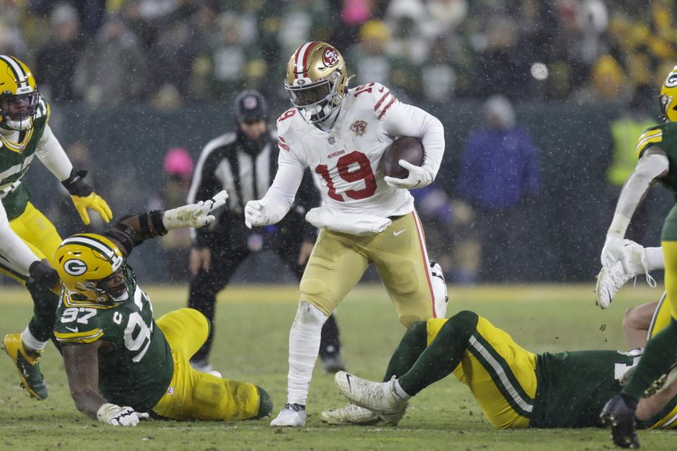 San Francisco 49ers' Deebo Samuel runs during the second half of an NFC divisional playoff NFL football game against the Green Bay Packers Saturday, Jan. 22, 2022, in Green Bay, Wis. (AP Photo/Matt Ludtke)