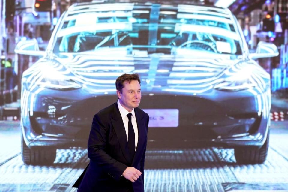 <div class="inline-image__caption"><p>Elon Musk during an opening ceremony for Tesla}s China-made Model Y program in Shanghai.</p></div> <div class="inline-image__credit">Aly Song/Reuters</div>