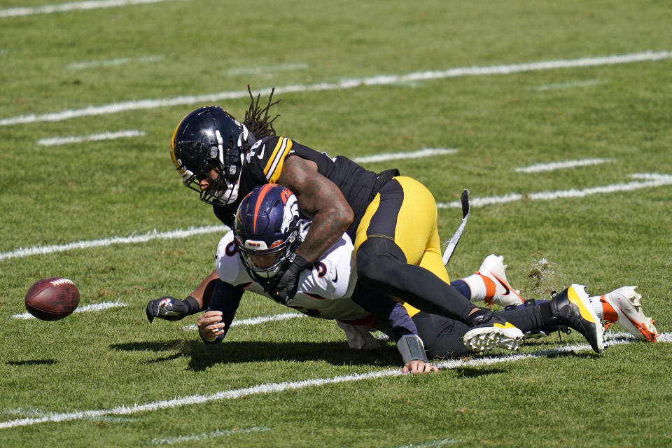 Pittsburgh Steelers outside linebacker Bud Dupree (48) forces a fumble by Denver Broncos quarterback Drew Lock (3) during the first half of an NFL football game, Sunday, Sept. 20, 2020, in Pittsburgh. The Steelers recovered the fumble and Lock was injured on the play. (AP Photo/Keith Srakocic)