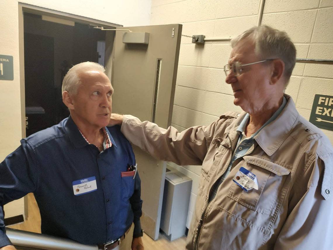 Kenneth Patrick, left, and former Lexington Mayor Scotty Baesler gathered at the Athens Schoolhouse for a reunion of class members from the 1950s and 1960s Saturday. Karla Ward/kward1@herald-leader.com