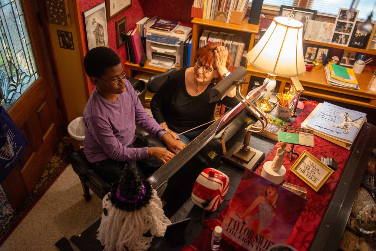 Ty Boyd practices sight reading a piece of music with his piano teacher Rita Winter inside her home in Martin, Tenn., on Monday, Oct. 16, 2023. Boyd is on the autism spectrum and has found music as a therapy beneficial. Kim Boyd, Ty's mother, worries that if Tennessee rejects federal funding for education, education for those with disabilities could suffer as a result.