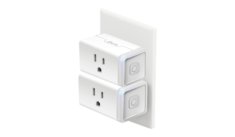 2 white smart home plugs plugged into a wall outlet