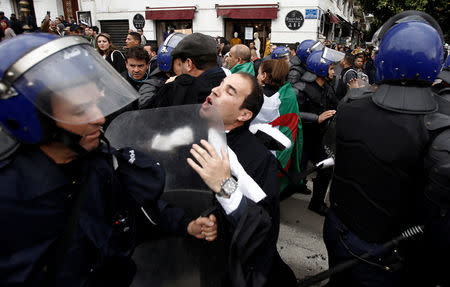 Police try to disperse lawyers marching during a protest to demand the immediate resignation of President Abdelaziz Bouteflika, in Algiers, Algeria March 23, 2019. REUTERS/Ramzi Boudina