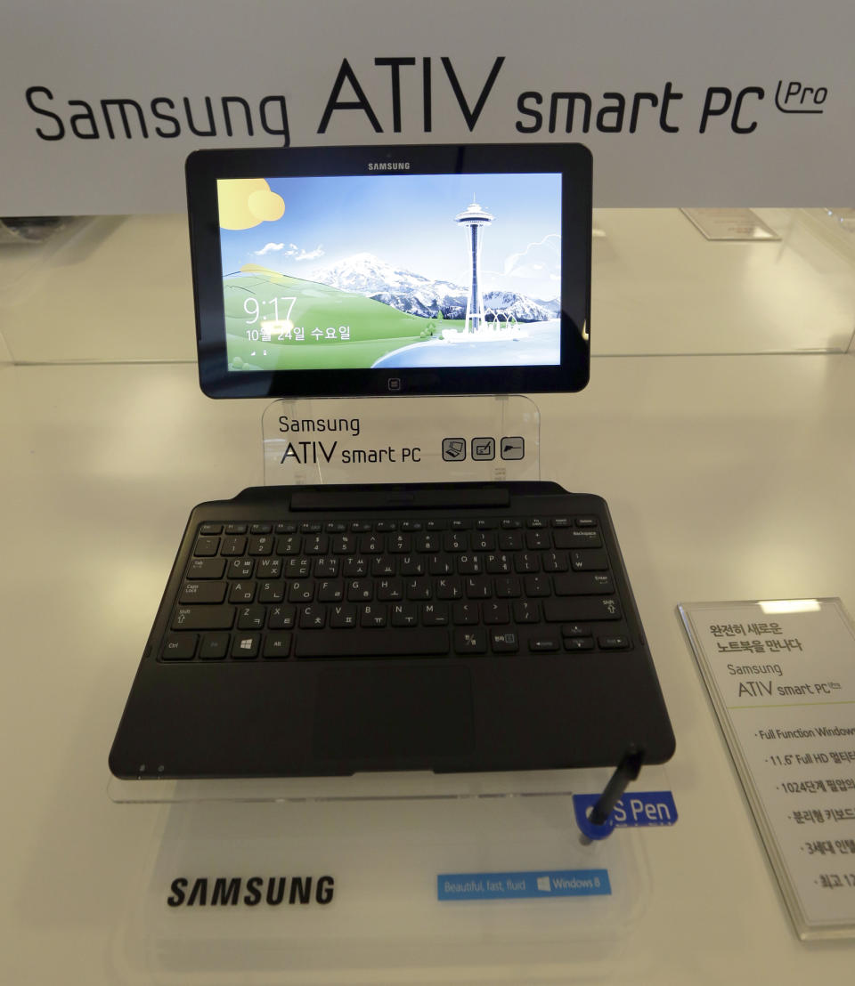 Samsung Electronics Co.'s ATIV smart PC, powered by a new version of Microsoft's Windows operating system, is displayed before a media briefing, in Seoul, South Korea, Wednesday, Oct. 24, 2012. Samsung said Wednesday it expects 10 percent growth in PC sales by volume this year as it bets on new PCs that are hybrids of laptops and tablets to lift sluggish PC demand. (AP Photo/Lee Jin-man)