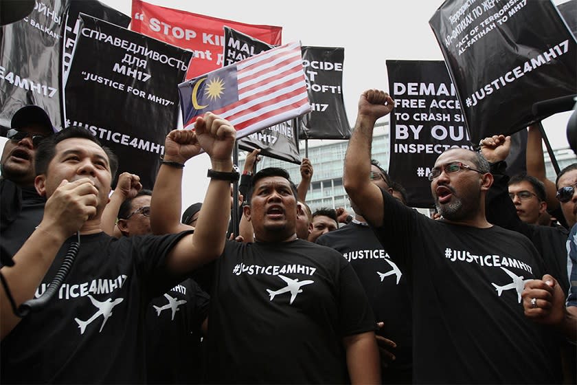 Barisan Nasional Youth members stage a protest at the Russian and Ukrainian embassies demanding answers for what they called the ‘genocide’ of Malaysian Airlines Flight MH17 passengers and crew, Kuala Lumpur, July 22, 2014. ― Picture by Yusof Mat Isa