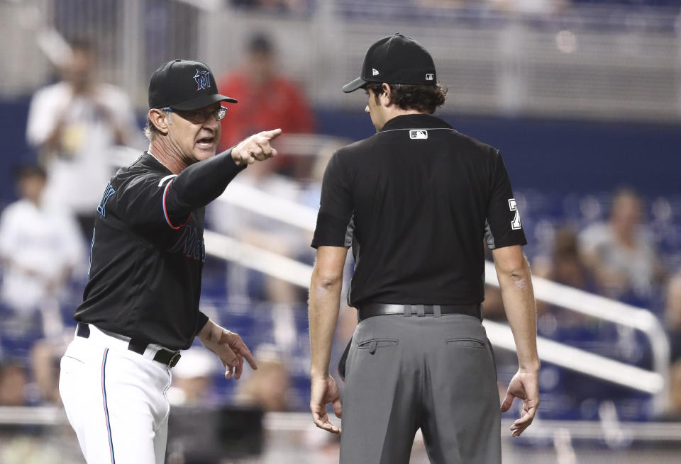 Miami Marlins manager Don Mattingly yells towards umpire John Tumpane after a balk call was made on Miami Marlins starting pitcher Caleb Smith during the fifth inning of the team's baseball game against the Atlanta Braves on Friday, Aug. 9, 2019, in Miami. Mattingly was thrown out of the game. (AP Photo/Brynn Anderson)