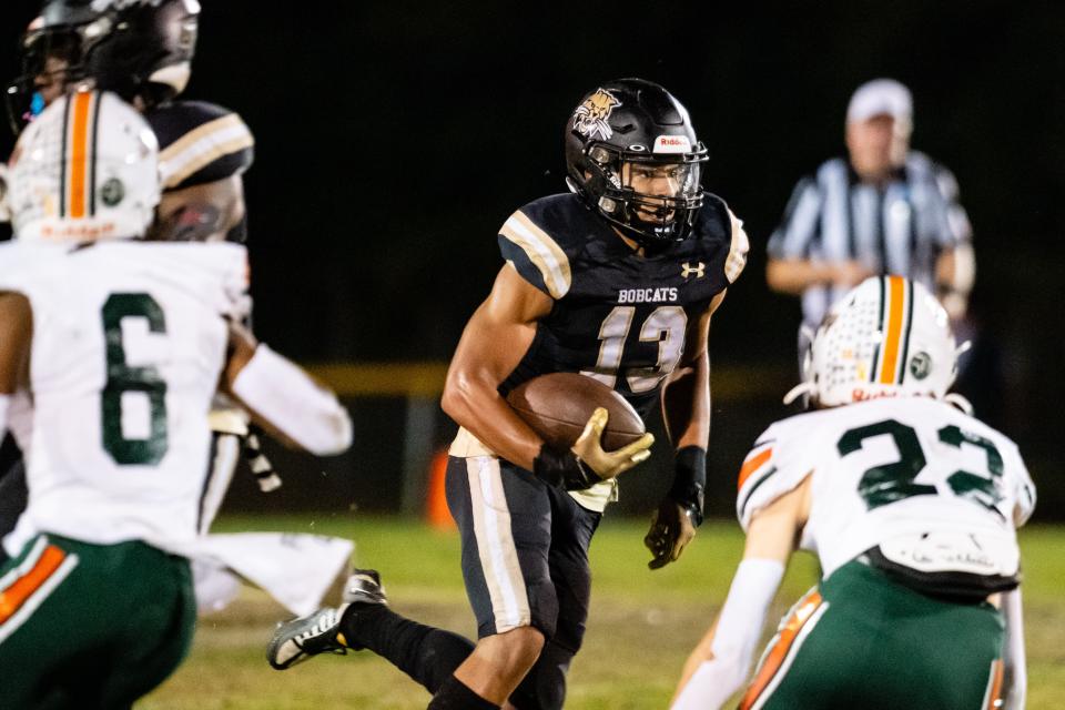 Buchholz Bobcats Justin Williams (13) runs with the ball during the first half between Buchholz High School and Mosley High School at Citizens Field in Gainesville, FL on Thursday, November 9, 2023. [Chris Watkins/Gainesville Sun]